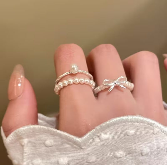 A Set of Three Bow Shaped Imitation Pearl Rings