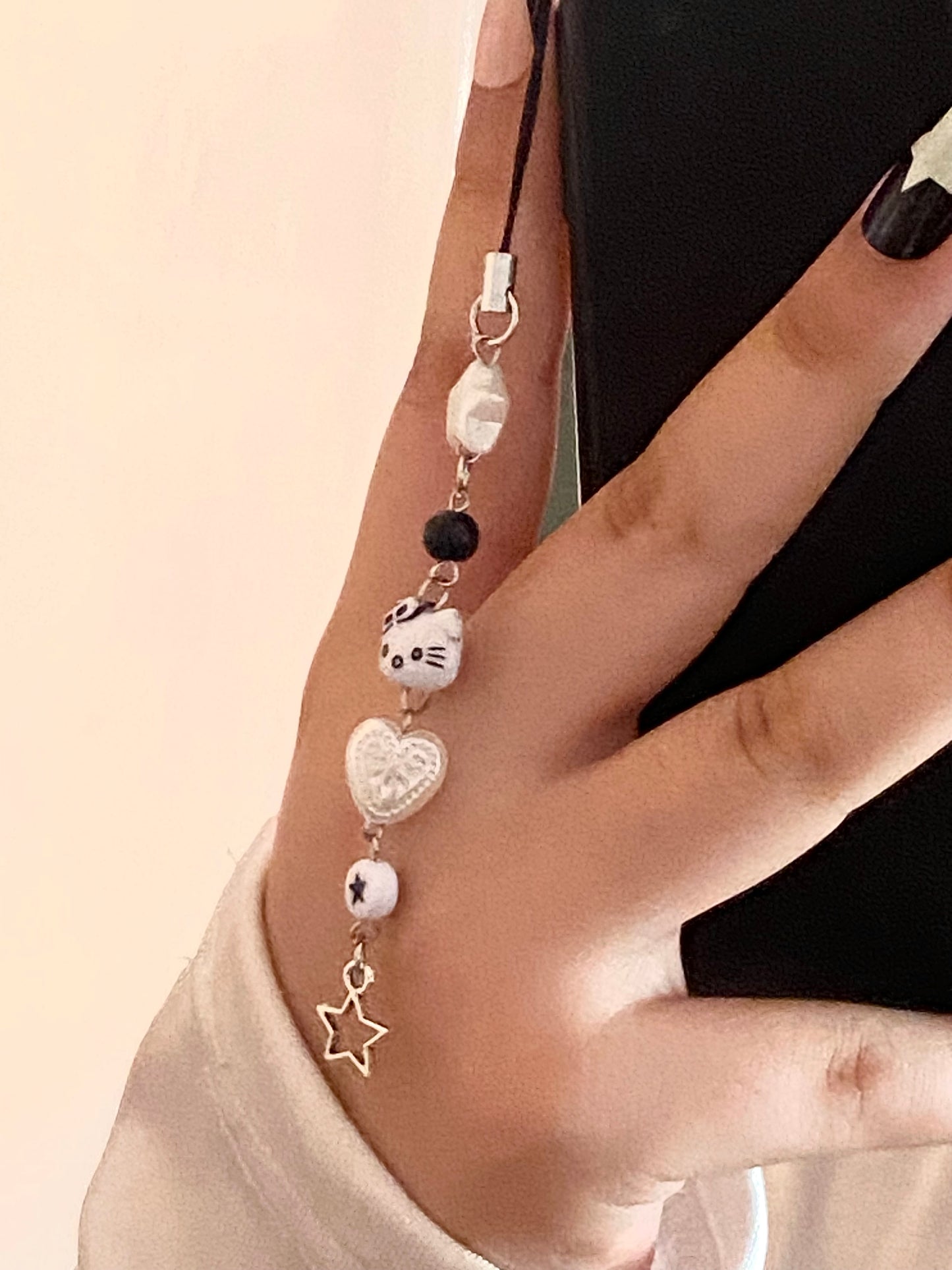 Black hello kitty phone charm