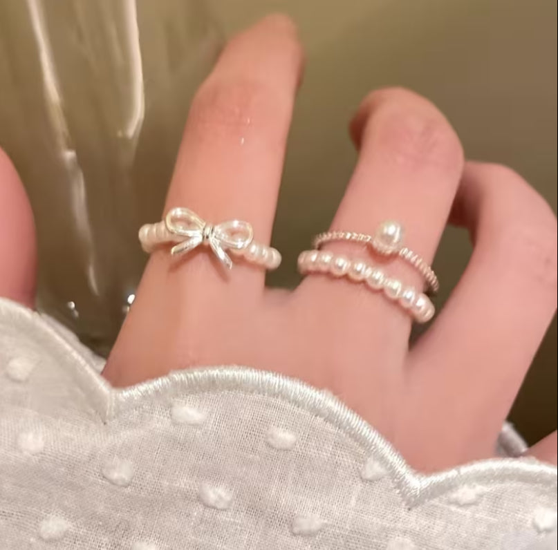 A Set of Three Bow Shaped Imitation Pearl Rings